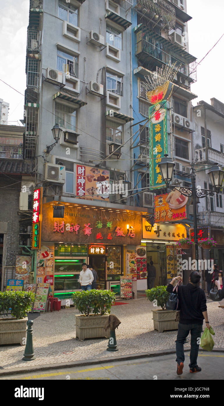 Apartments above shops and restaurant. Macau Stock Photo