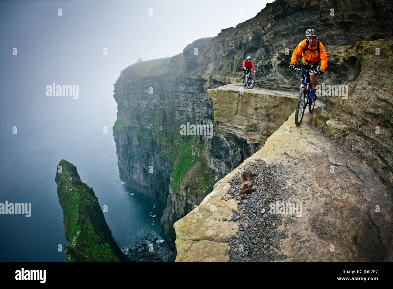 Professional mountain bikers Hans Rey and Steve Peat riding the Cliffs ...
