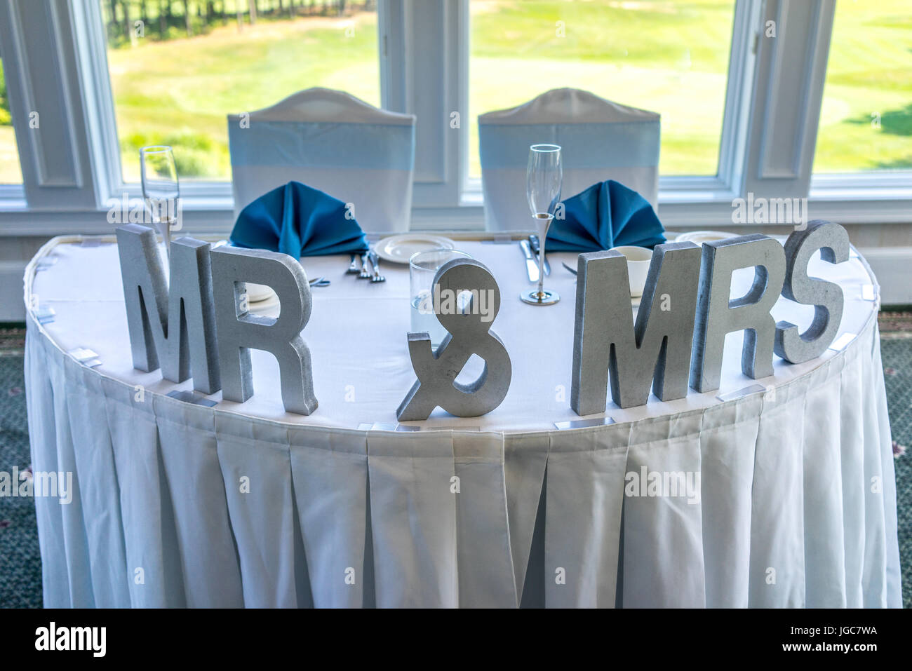 Wedding head table setting with Mr & Mrs letters. Stock Photo