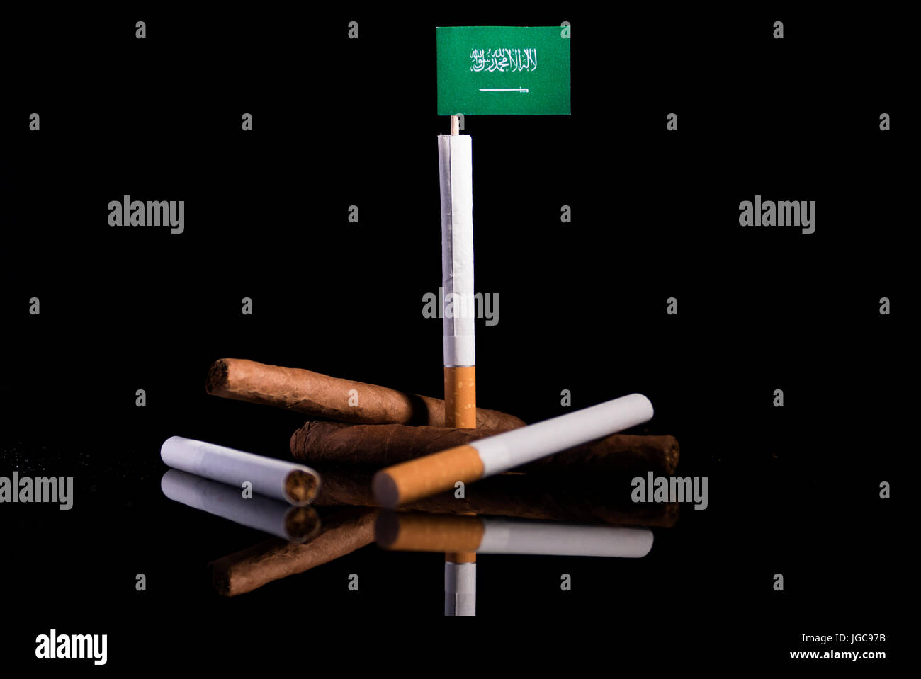 Saudi Arabian flag with cigarettes and cigars. Tobacco Industry concept