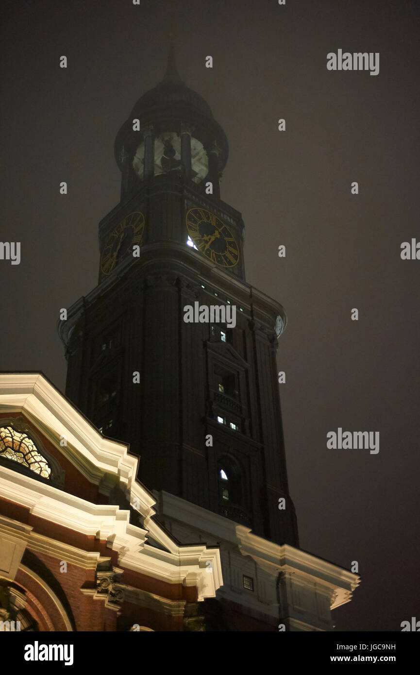 Tower of St. Michaelis Kirche (Michel) at a foggy night (Hamburg, Germany) Stock Photo