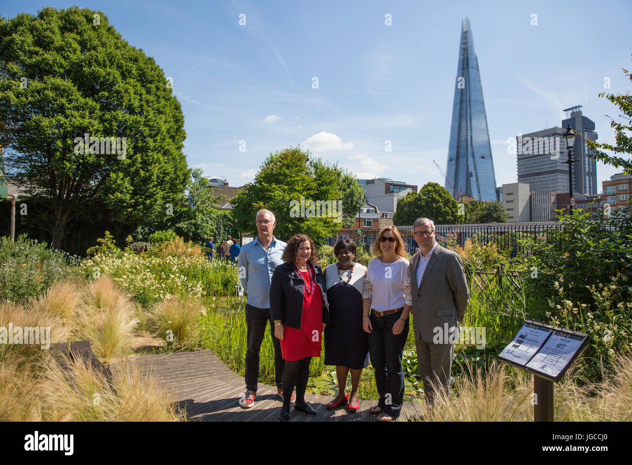 London, UK. 5th July, 2017. The London Assembly Environment Committee launches its report 'Park life: ensuring green spaces remain a hit with Londoners’ at Red Cross Garden, an historic and award-winning park restored to its original Victorian design. L-R: Paul Ely (Director, Bankside Open Spaces Trust), Leonie Cooper AM (Chair, London Assembly Environment Committee), Jennette Arnold AM OBE, Megan Greenwood (local resident and volunteer) and Joseph Bonner (trustee). Credit: Mark Kerrison/Alamy Live News Stock Photo