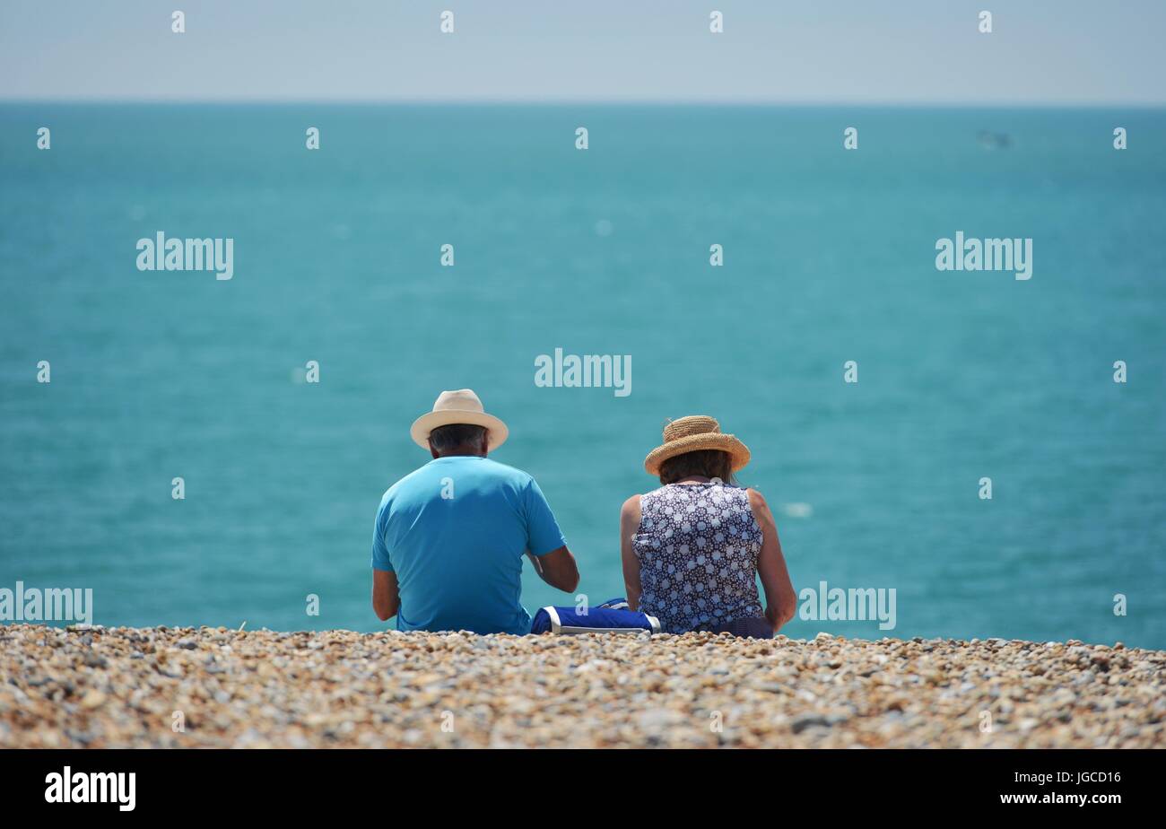 Seaford, East Sussex. 5th July 2017. People enjoying the warm weather on Seaford Beach, East Sussex as temperatures temporarily soar. Credit: Peter Cripps/Alamy Live News Stock Photo