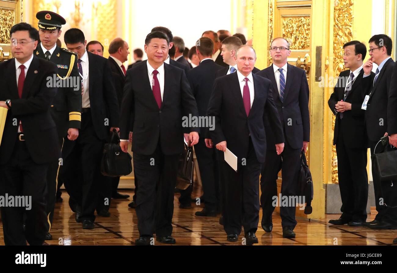 Russian President Vladimir Putin walks with Chinese President Xi Jinping following expanded bilateral meetings in the Kremlin July 4, 2017 in Moscow, Russia. Stock Photo