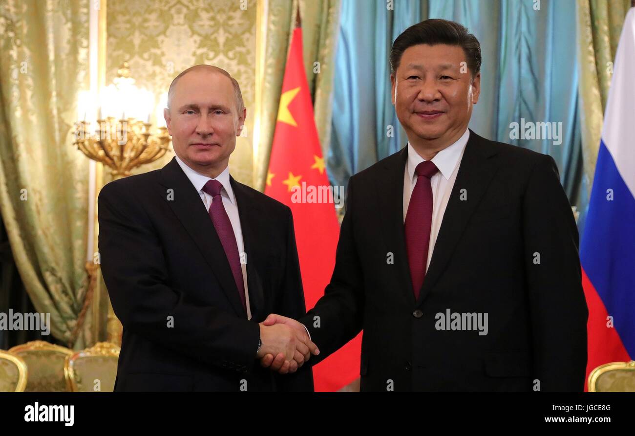 Russian President Vladimir Putin welcomes Chinese President Xi Jinping prior to bilateral talks in the Kremlin July 4, 2017 in Moscow, Russia. Stock Photo