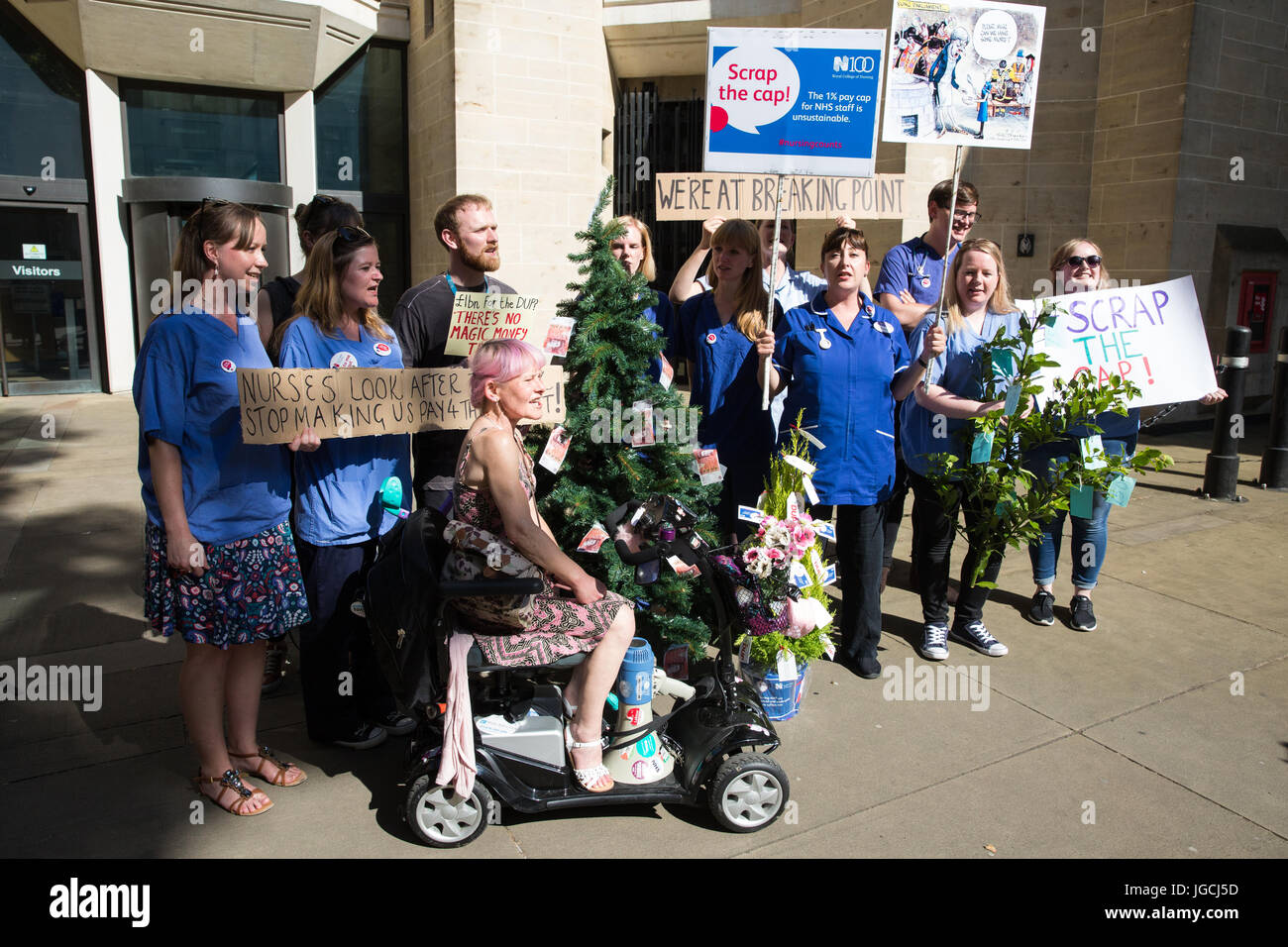 London, UK. 5th July, 2017. Nurses attend a 'Scrap the Cap' protest against ongoing cuts to the National Health Service outside the Department of Health, during which they attempted to deliver a magic money tree and a birthday cake marking the 69th birthday of the NHS. Credit: Mark Kerrison/Alamy Live News Stock Photo