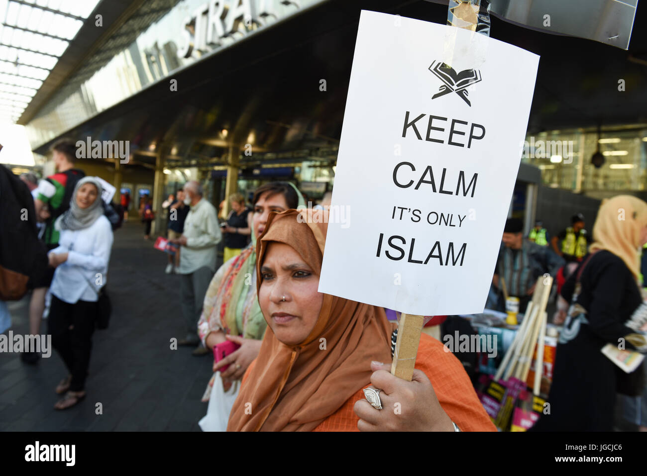 London, UK. 05th JUL 2017. 'STOP ACID ATTACKS' emergency protest outside the Stratford station in East London. Protesters gathered to protest against the recent acid attacks and increasing Islamophobia. A Muslim woman is holding a placard reading: 'Keep Calm It's Only Islam'. Credit: ZEN - Zaneta Razaite/Alamy Live News Stock Photo