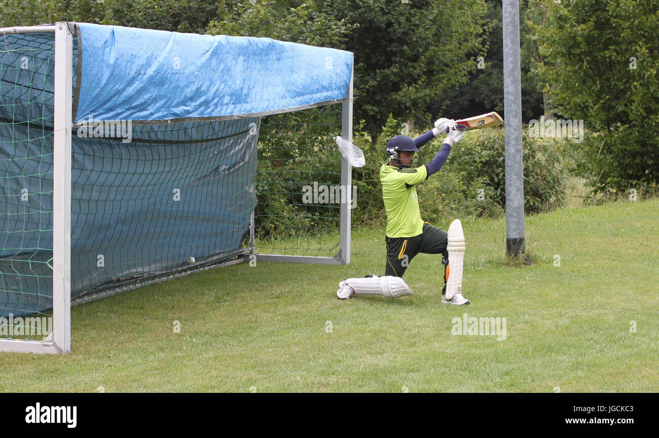 Bautzen, Germany. 02nd July, 2017. A player of the cricket team MSV Bautzen warms up at the junior centre Am Humboldthain in Bautzen, Germany, 02 July 2017. Amongst the refugees who came to Germany there are also a lot of cricket fans. A project in Bautzen shows how cricket can help them during their daily life. Players from different nations like India, Pakistan, Afghanistan and Germany got together as a team of the MSV Bautzen in 2016. Photo: Fabian Held/dpa/Alamy Live News Stock Photo