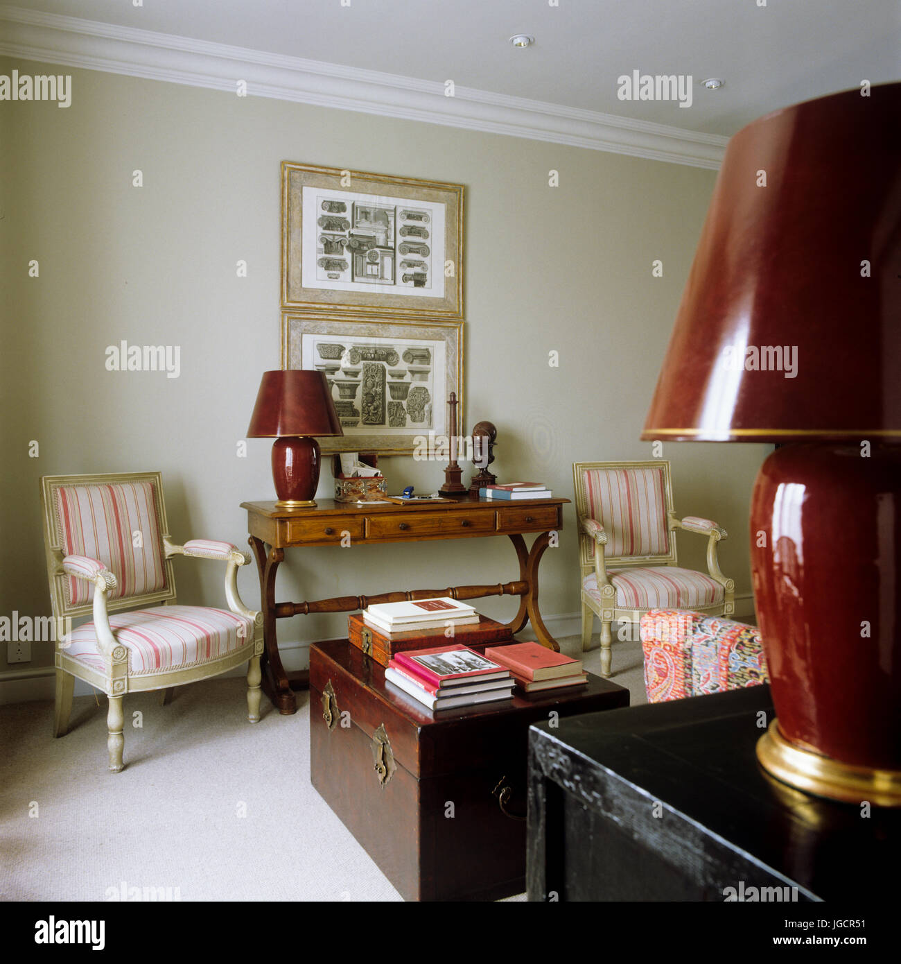 Living room with matching red lamps Stock Photo Alamy