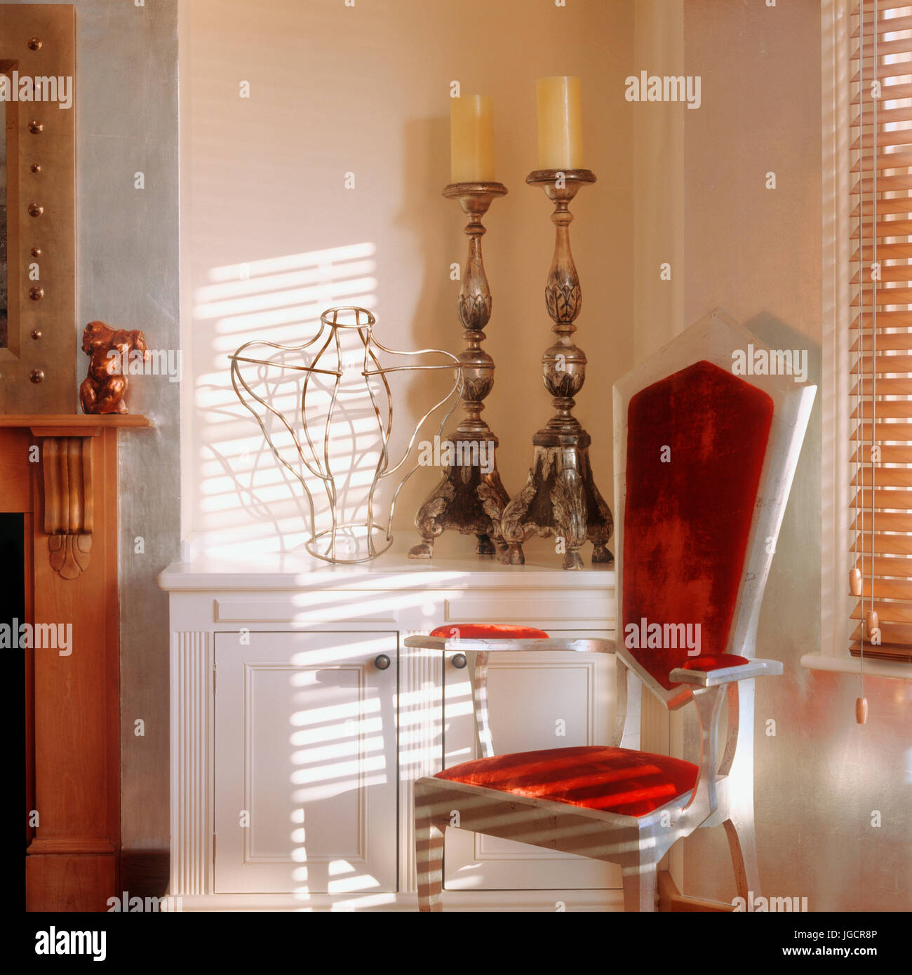Red armchair by candles Stock Photo