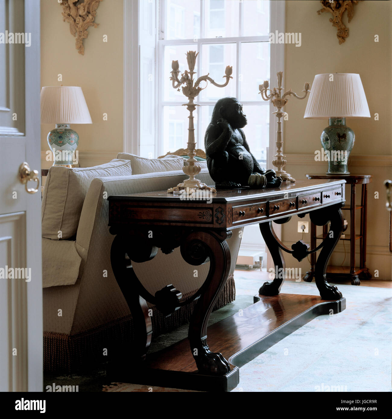 Gorilla sculpture on table in living room Stock Photo