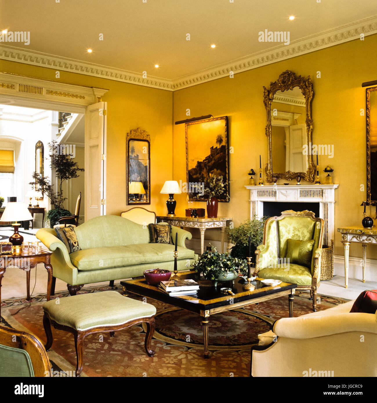 Edwardian living room with green seating Stock Photo