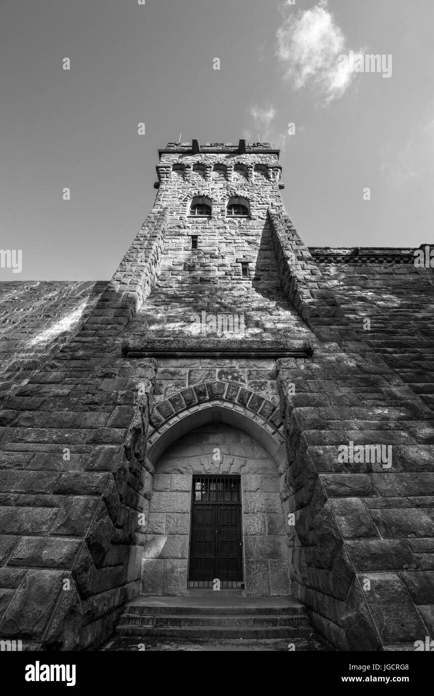 Looking up at the solid stone tower at Derwent reservoir in the Peak District, Derbyshire, England. Stock Photo
