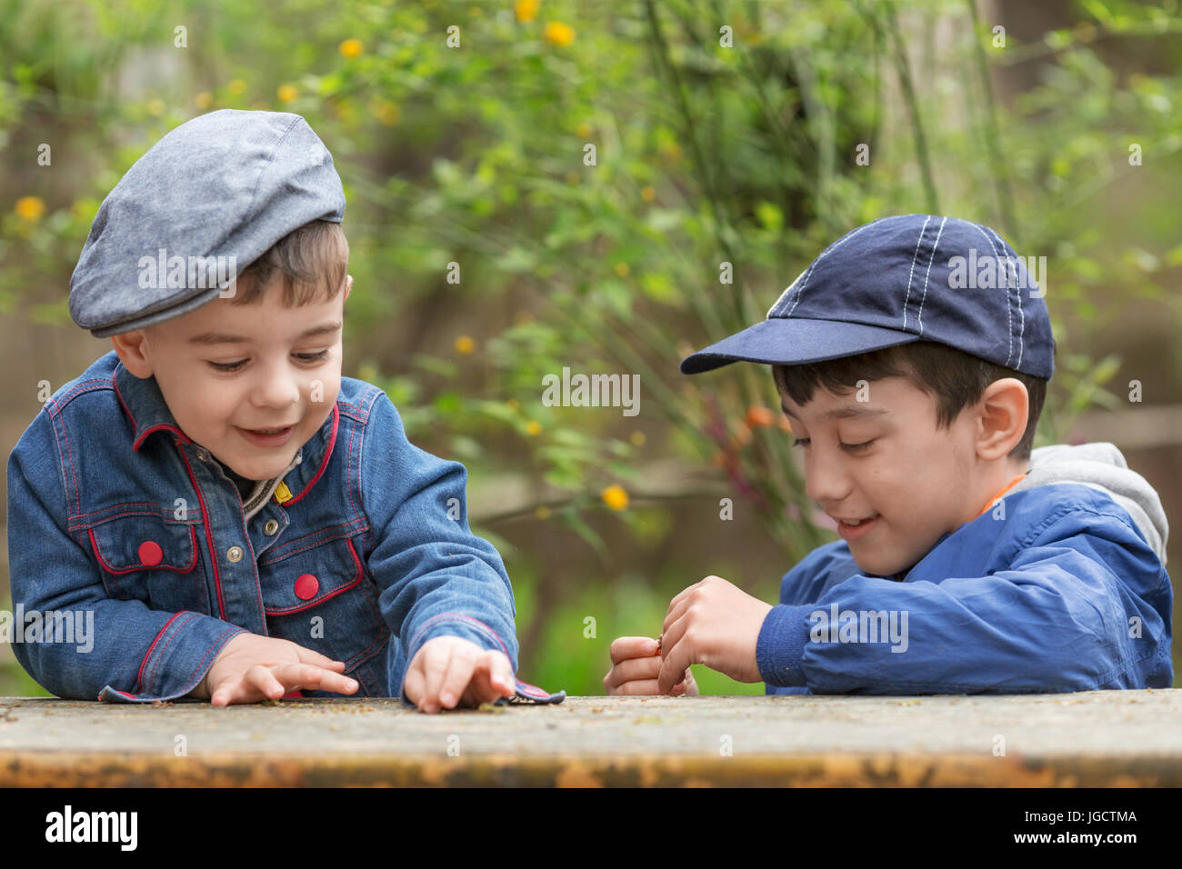 Two boys playing outdoors Stock Photo