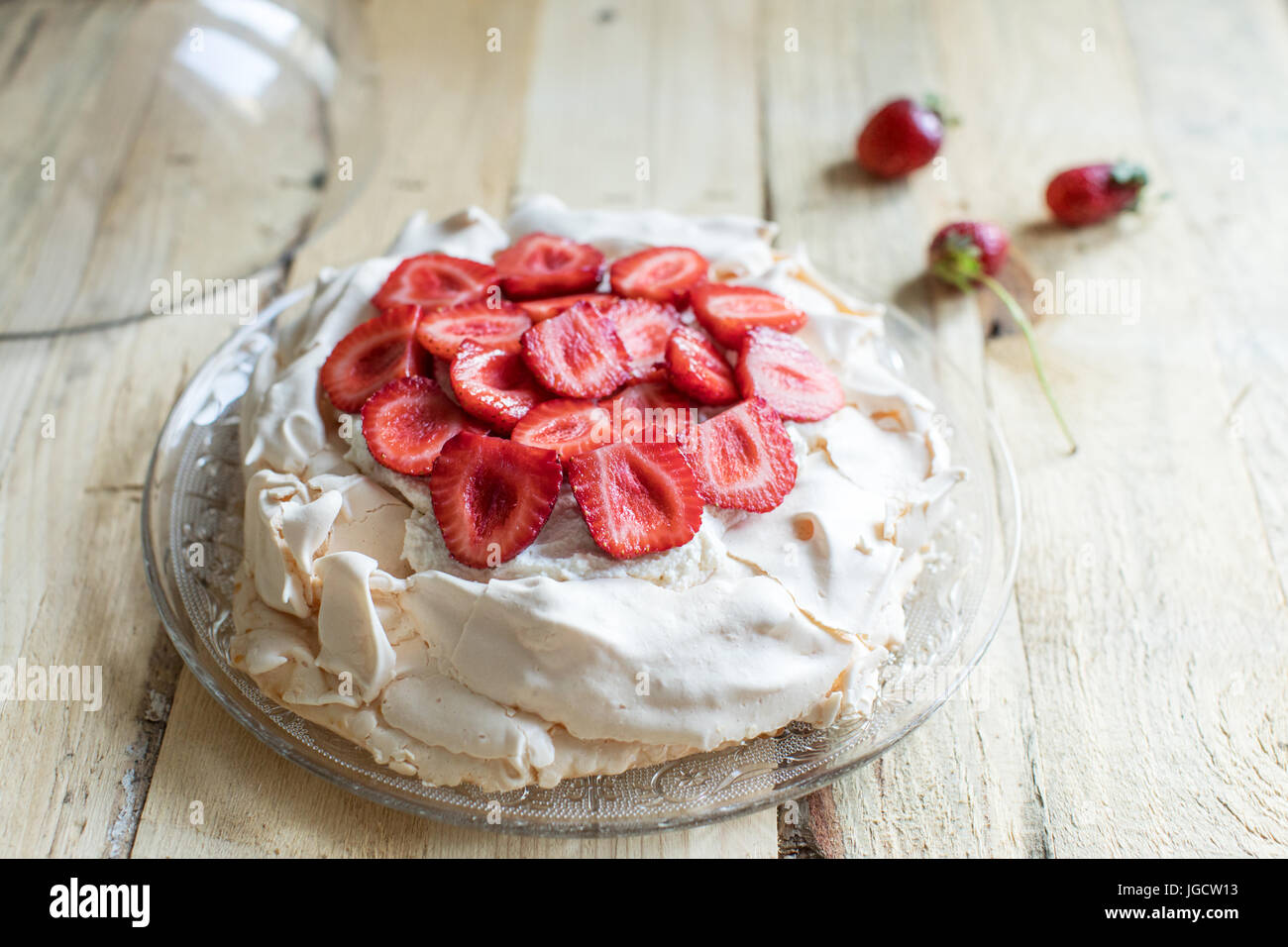 Overhead shot of Pavlova cake with strawberries Stock Photo
