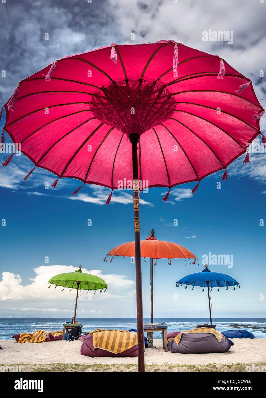 Multi-colored umbrellas on the beach, Bali, Indonesia Stock Photo