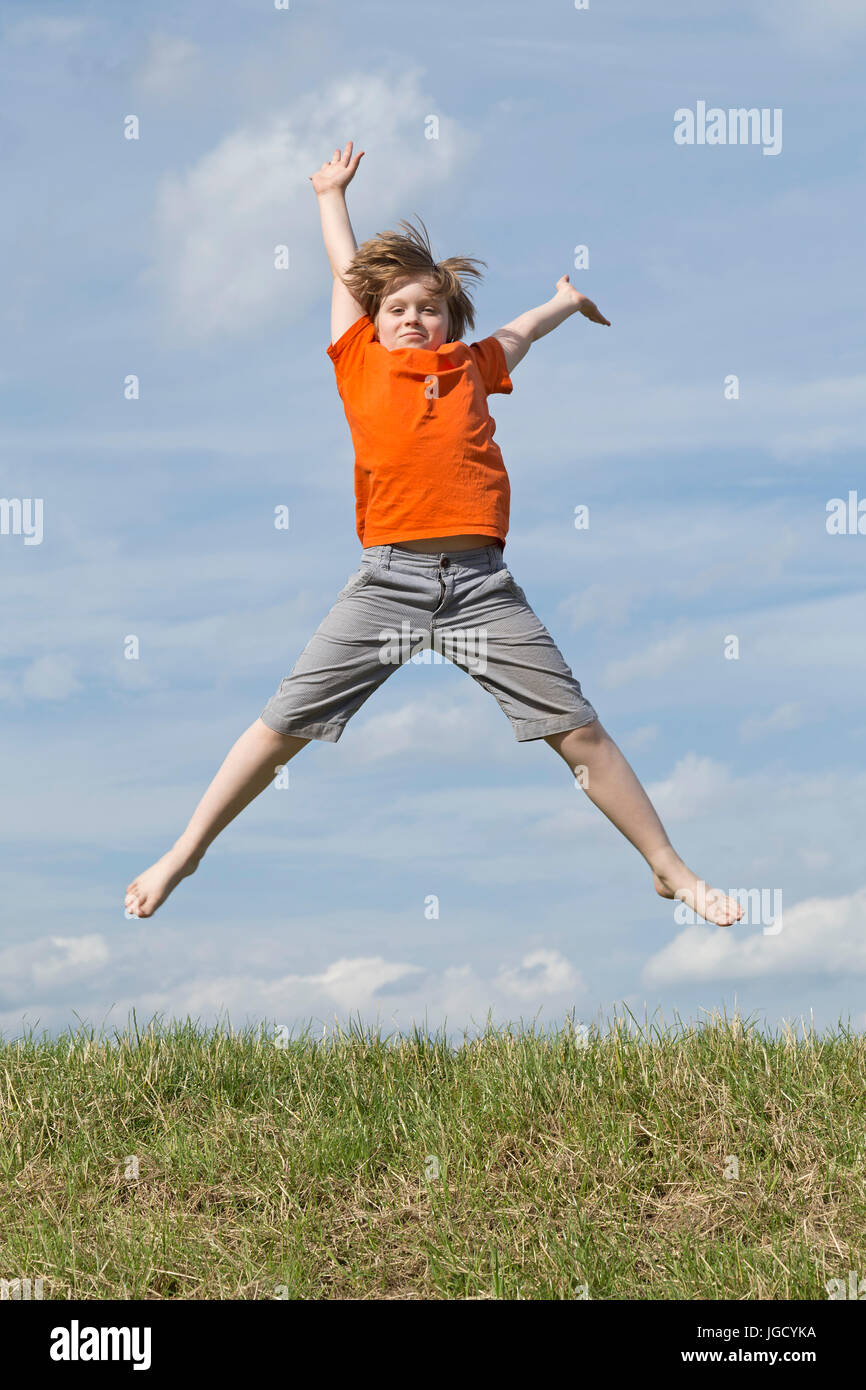 young boy jumping Stock Photo