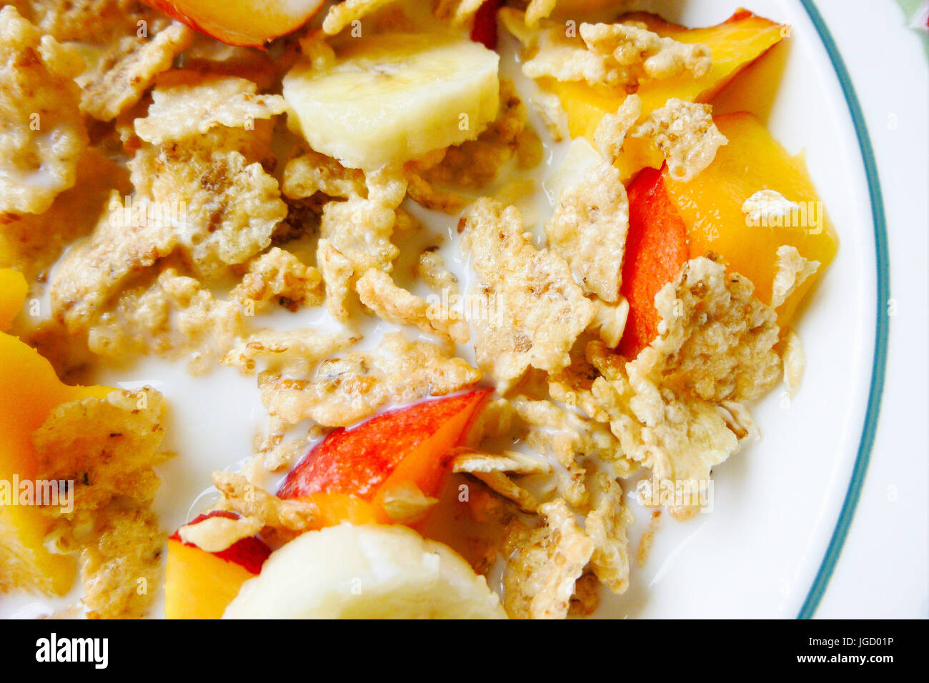 The hot weather makes a breakfast of rice flakes, nectarine and banana seem all the more appealing Stock Photo