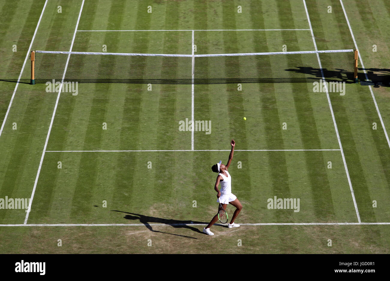 Venus Williams in action against Qiang Wang on day three of the Wimbledon Championships at The All England Lawn Tennis and Croquet Club, Wimbledon. Stock Photo