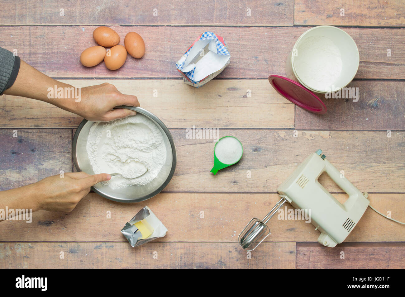 mixing flour, eggs, butter and sugar to cook a cake Stock Photo Alamy