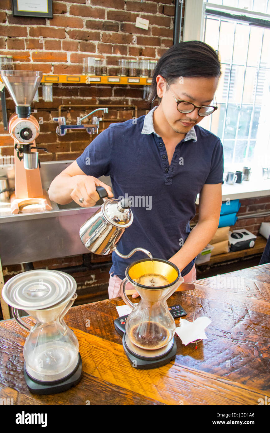 Pour over into a gold filter, Revolver Cafe, Cambie Street, Vancouver, Canada Stock Photo