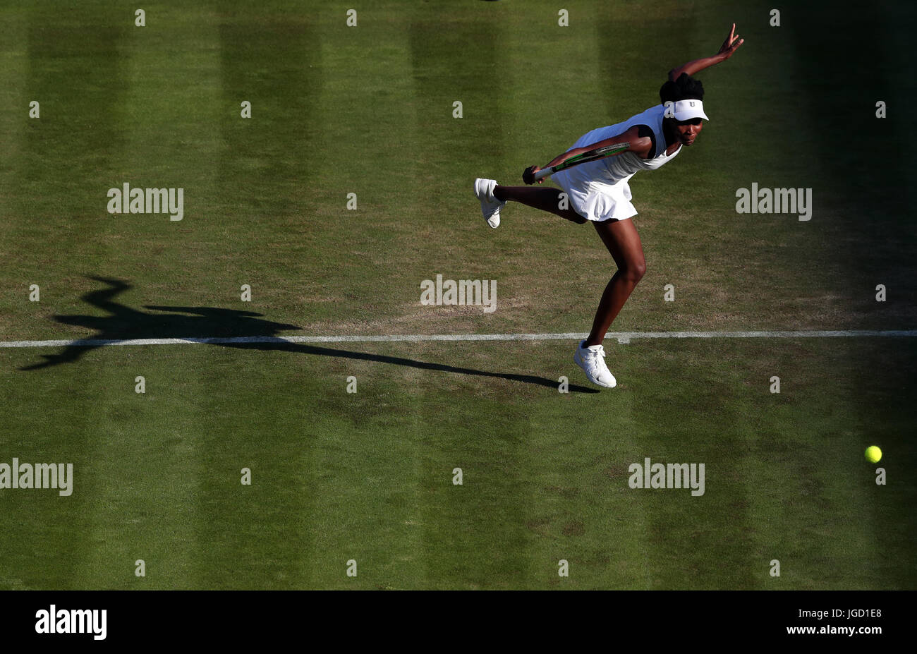 Venus Williams in action against Qiang Wang on day three of the Wimbledon Championships at The All England Lawn Tennis and Croquet Club, Wimbledon. Stock Photo