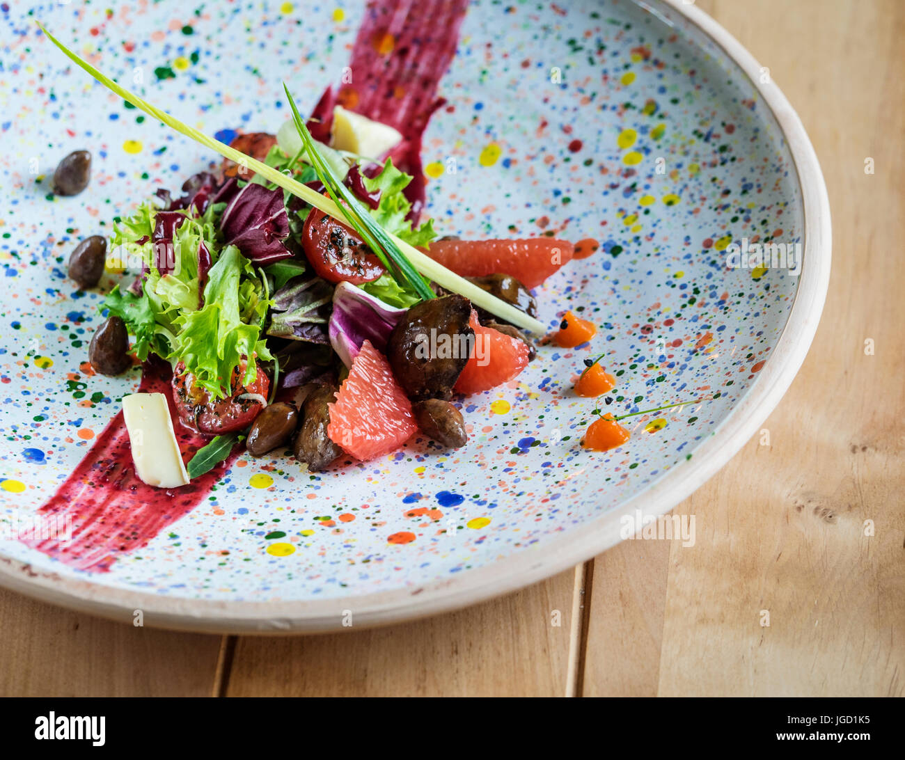 Salad with quail liver and grapefruit. Selective focus Stock Photo Alamy