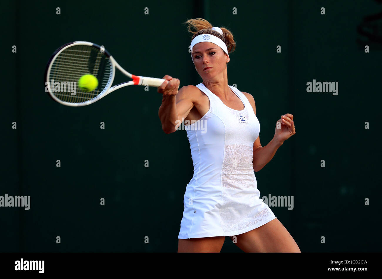 Camila Giorgi in action against Madison Keys on day three of the Wimbledon Championships at The All England Lawn Tennis and Croquet Club, Wimbledon. Stock Photo