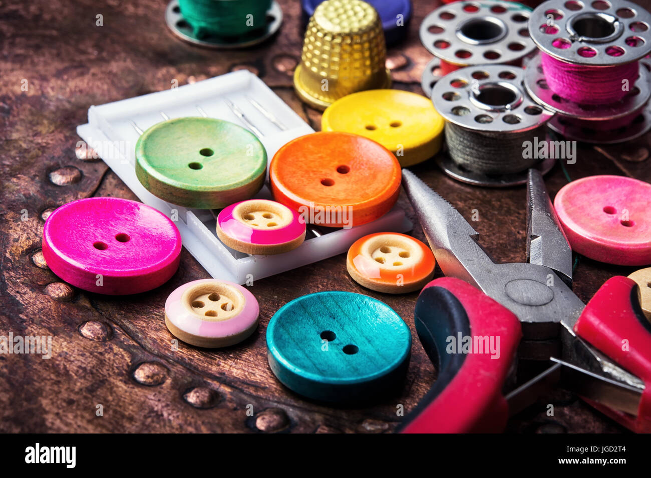 Domestic collection of colourful sewing retro buttons and threads Stock