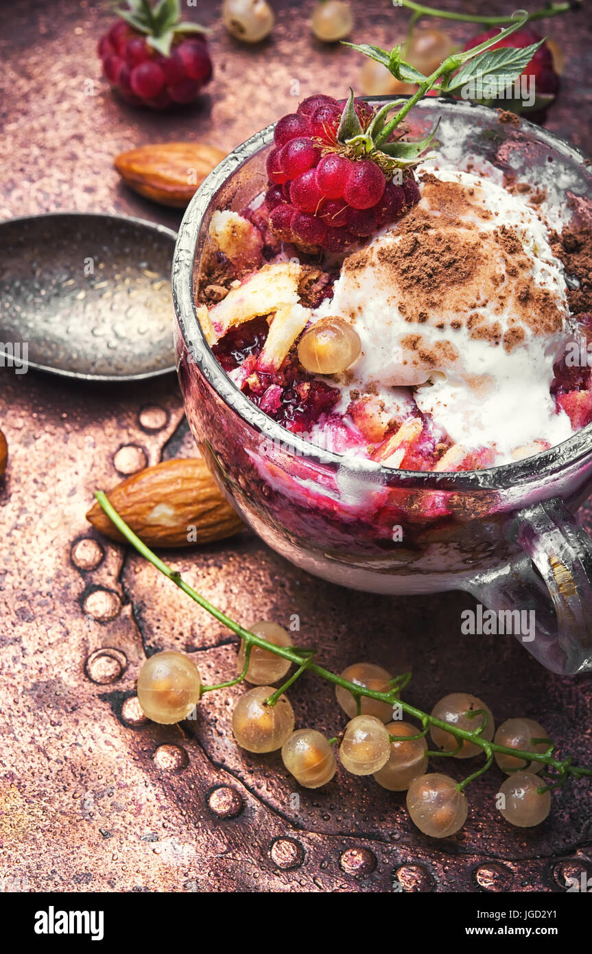 Sundae ice cream with raspberry taste in a glass mug Stock Photo - Alamy