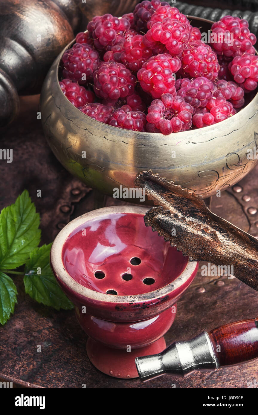 Smoking Turkish hookah with tobacco with raspberry flavor Stock Photo ...