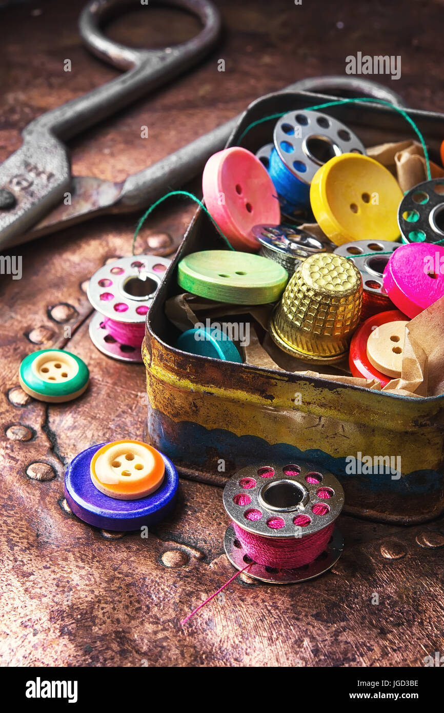Old-fashioned metal box with buttons and threads Stock Photo - Alamy