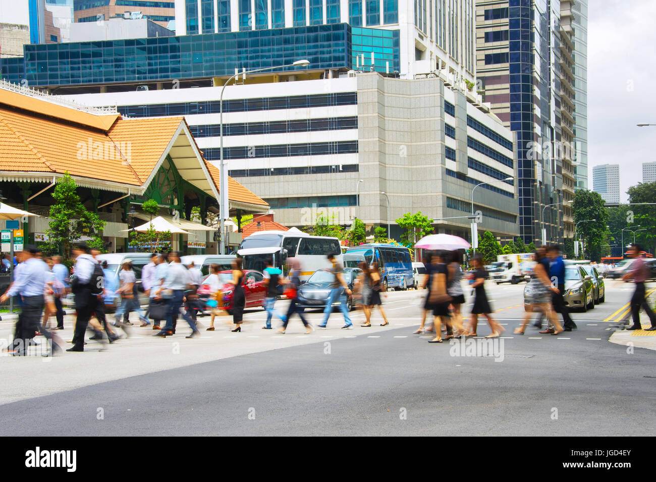 People crossing a road in Singapore business downtown Stock Photo - Alamy