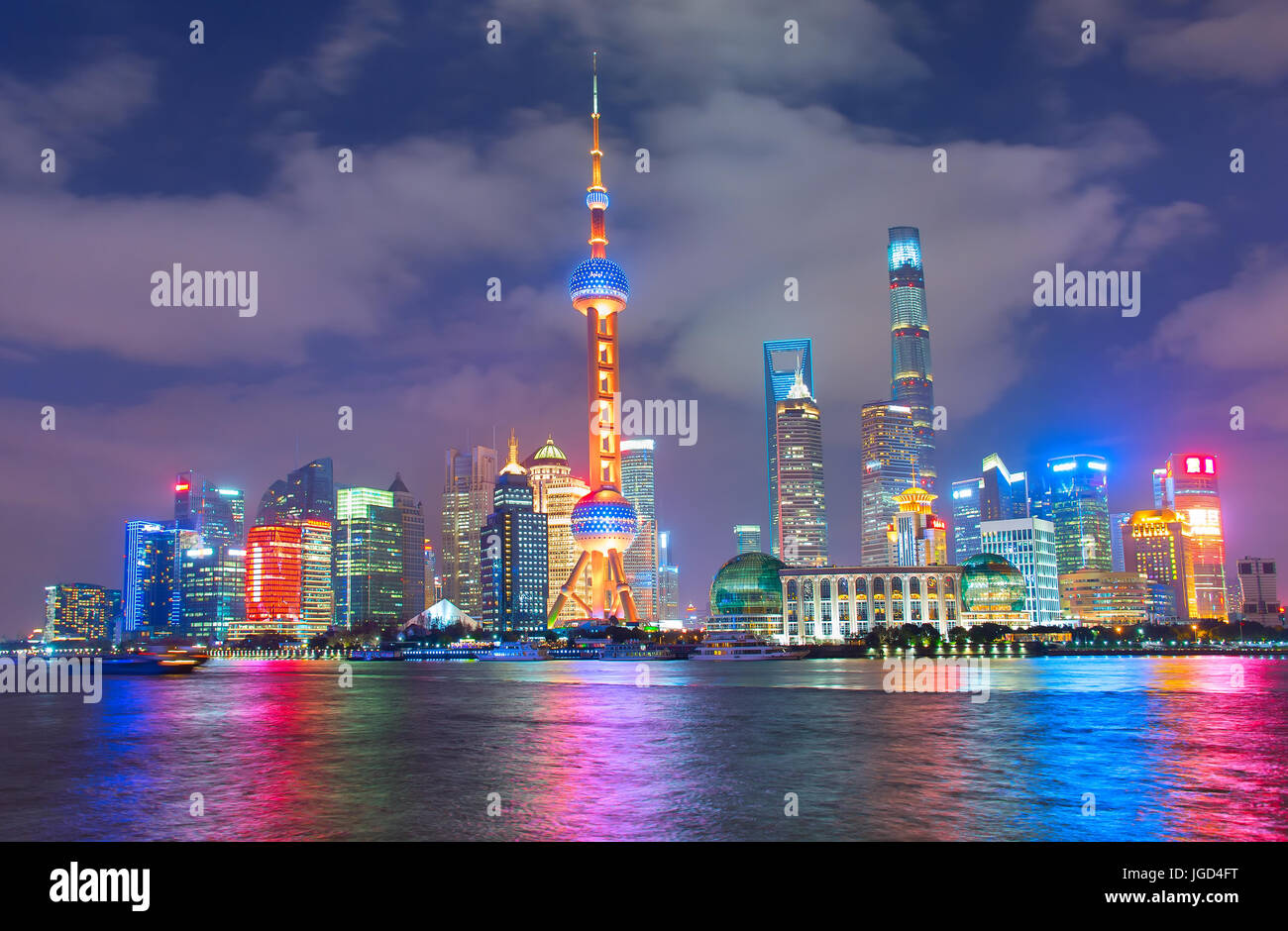 Cityscape of Shanghai Downtown at night with reflection in the river Stock Photo