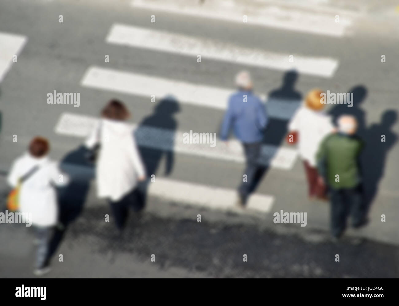 Aerusl view of people crossing the street. Lens blur Stock Photo