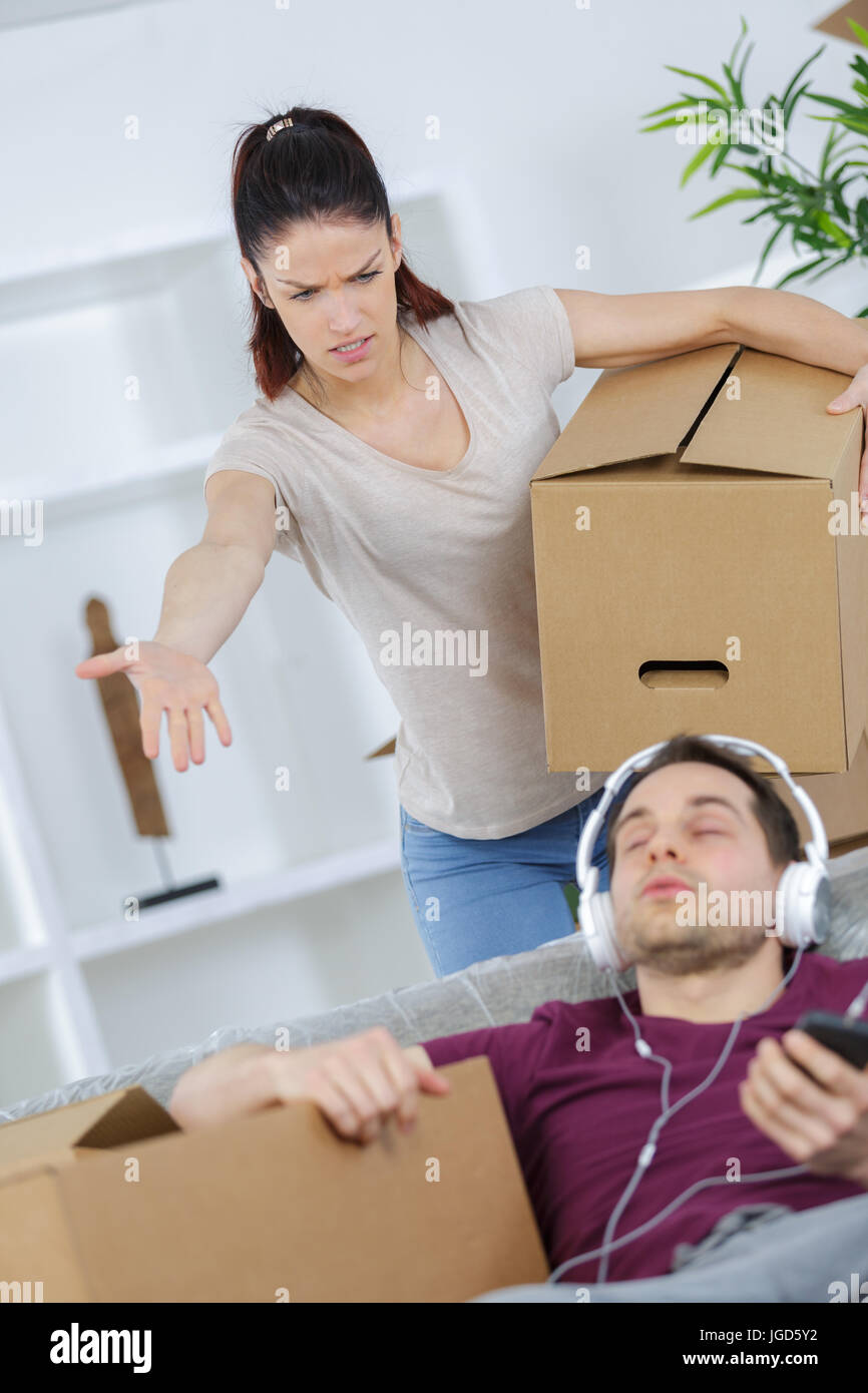 young woman threatening husband at home Stock Photo Alamy