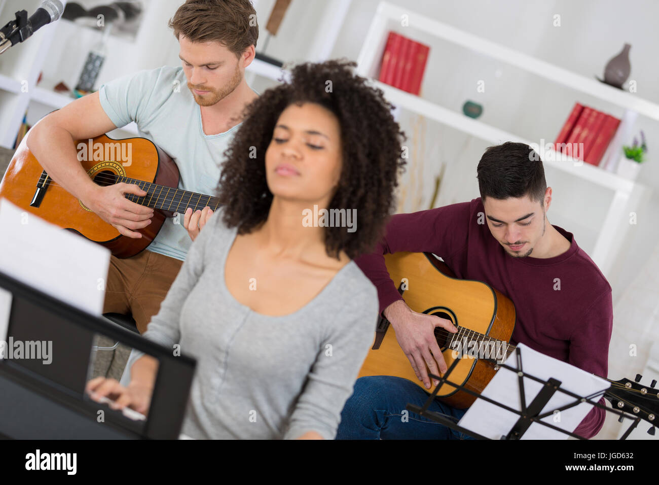 home band learning new song together Stock Photo Alamy