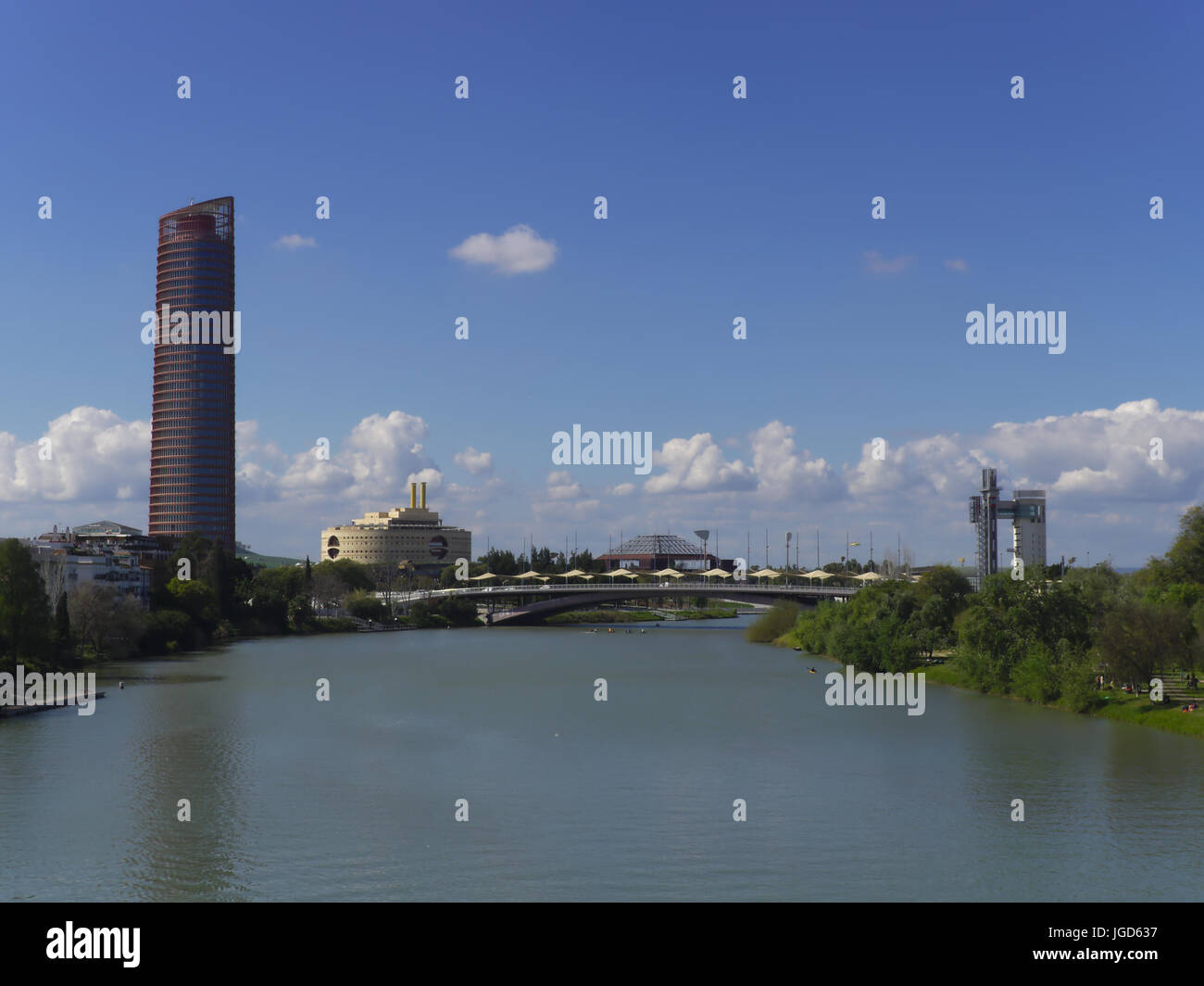 Seville, Spain -  March 28th, 2017. View north of the Guadalquivir from Bridge of Triana. From left to right can be seen Seville , Triana and schindle Stock Photo