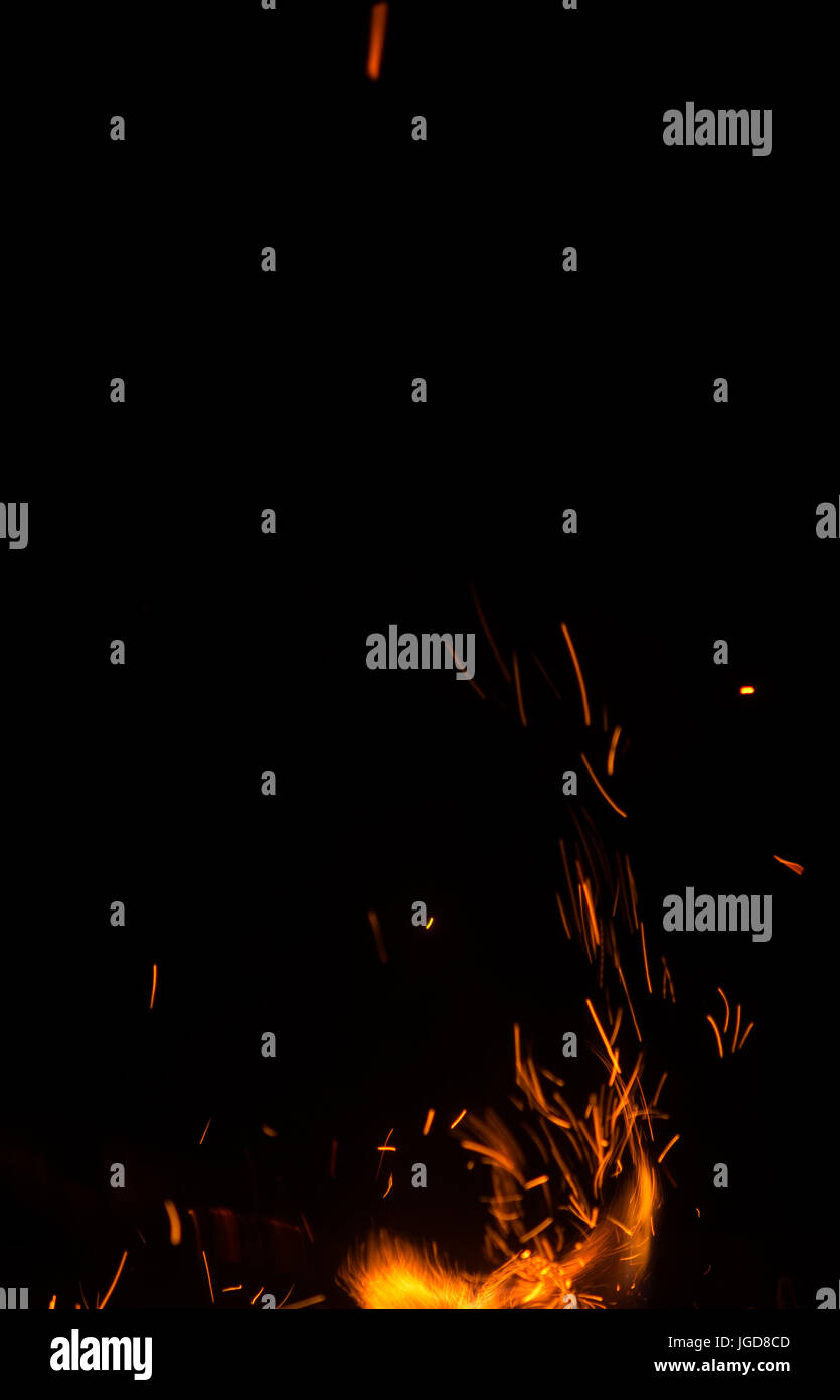 fire flames with sparks on black background Stock Photo - Alamy