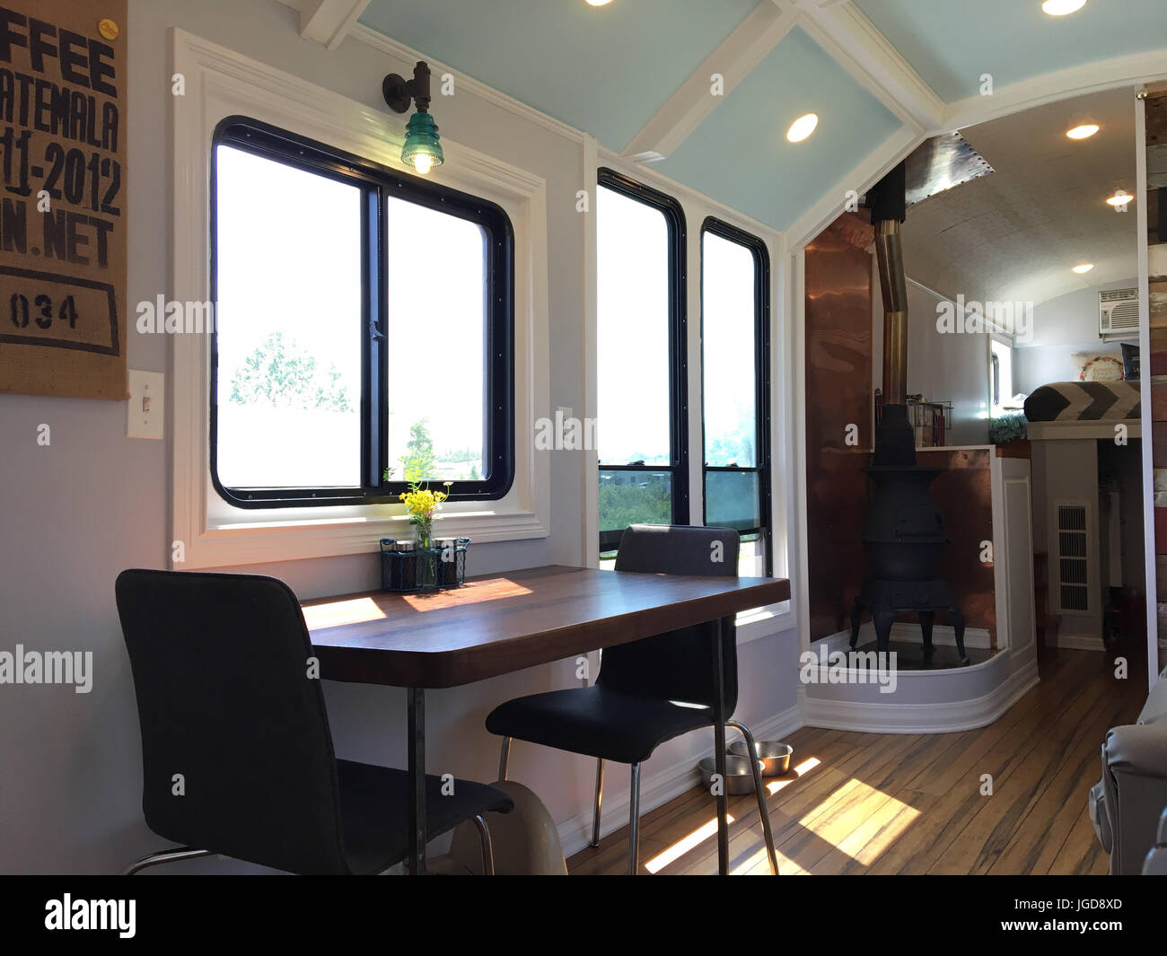 MEET the family who spent more than £23K converting their iconic American school bus into an off-grid mobile home complete with extended ceiling as th Stock Photo
