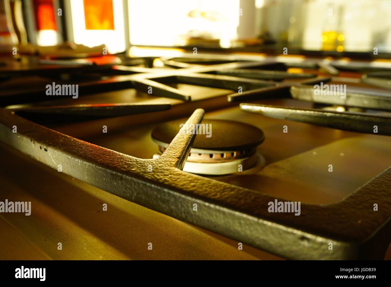 Close up of Black iron gas stove top in kitchen Stock Photo