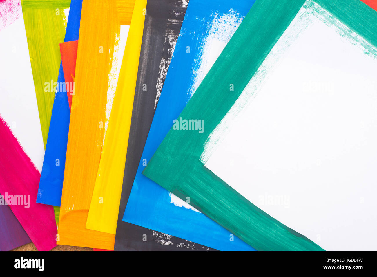 group of multicolored painted paper sheets Stock Photo