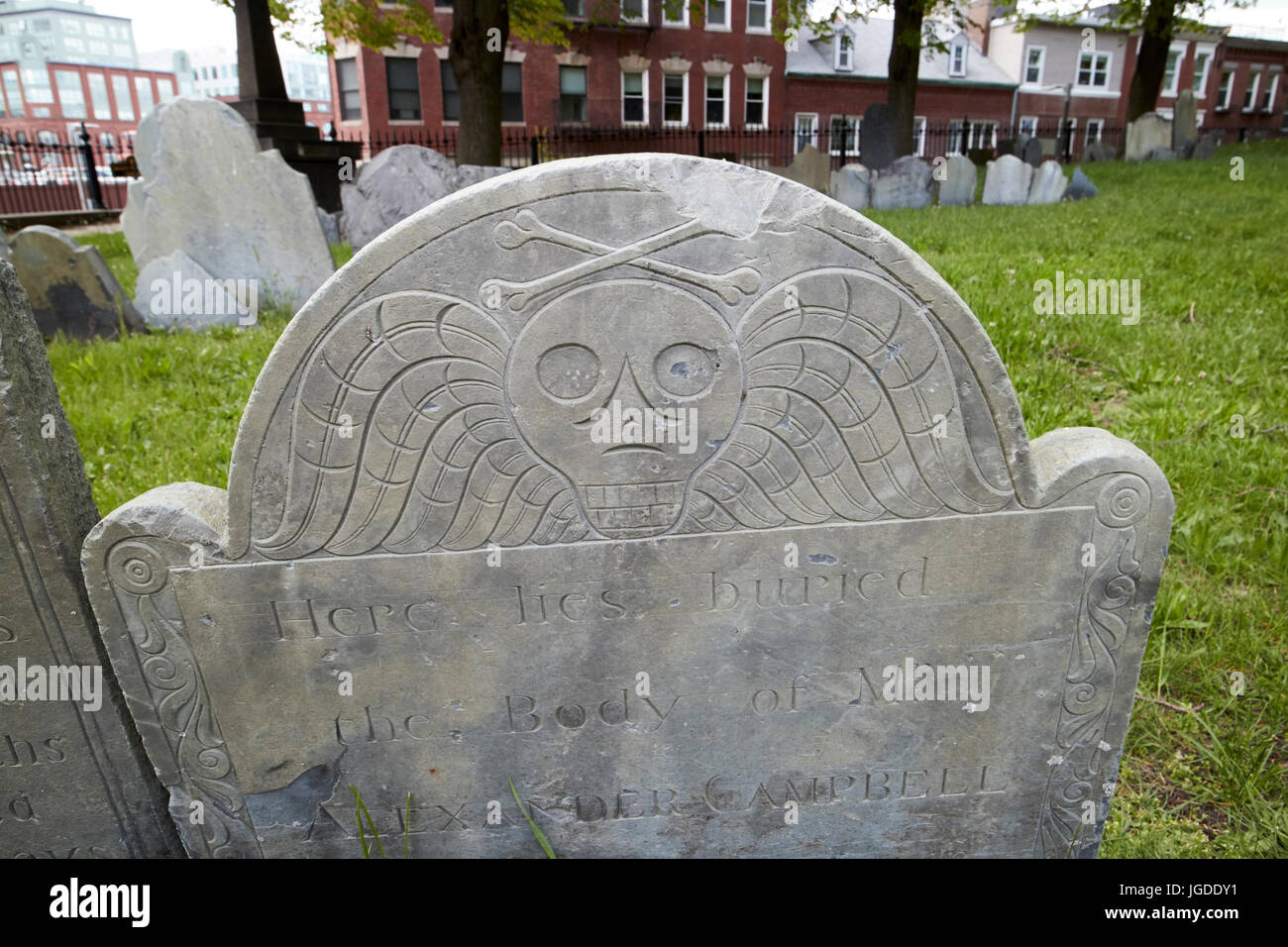 winged skull and crossbones on gravestones in copps hill burying ground Boston USA Stock Photo