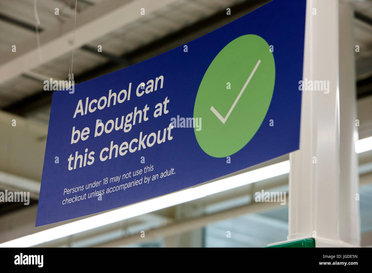 alcohol can be bought at this checkout sign in a tesco supermarket Stock Photo