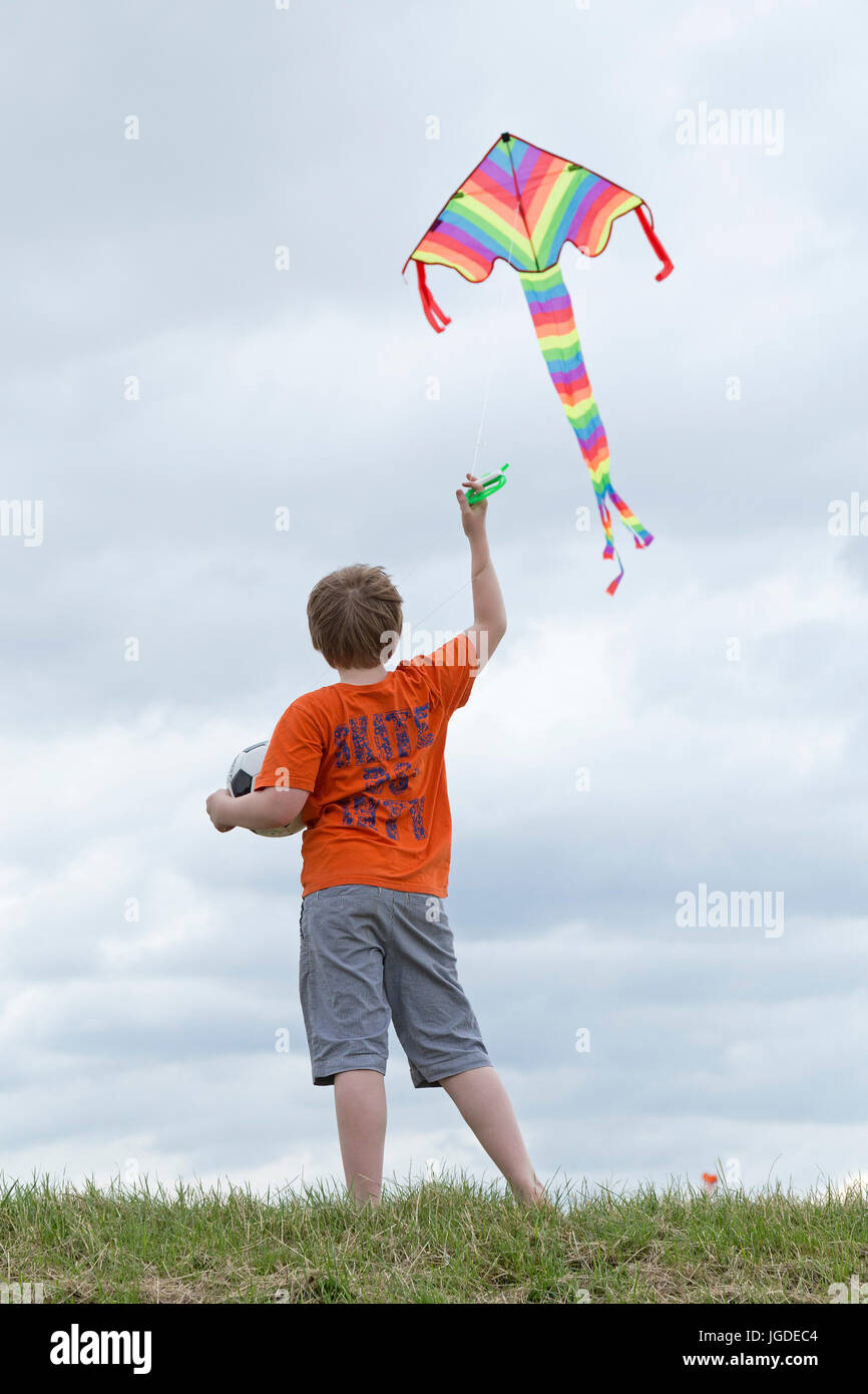 young boy flying kite Stock Photo - Alamy