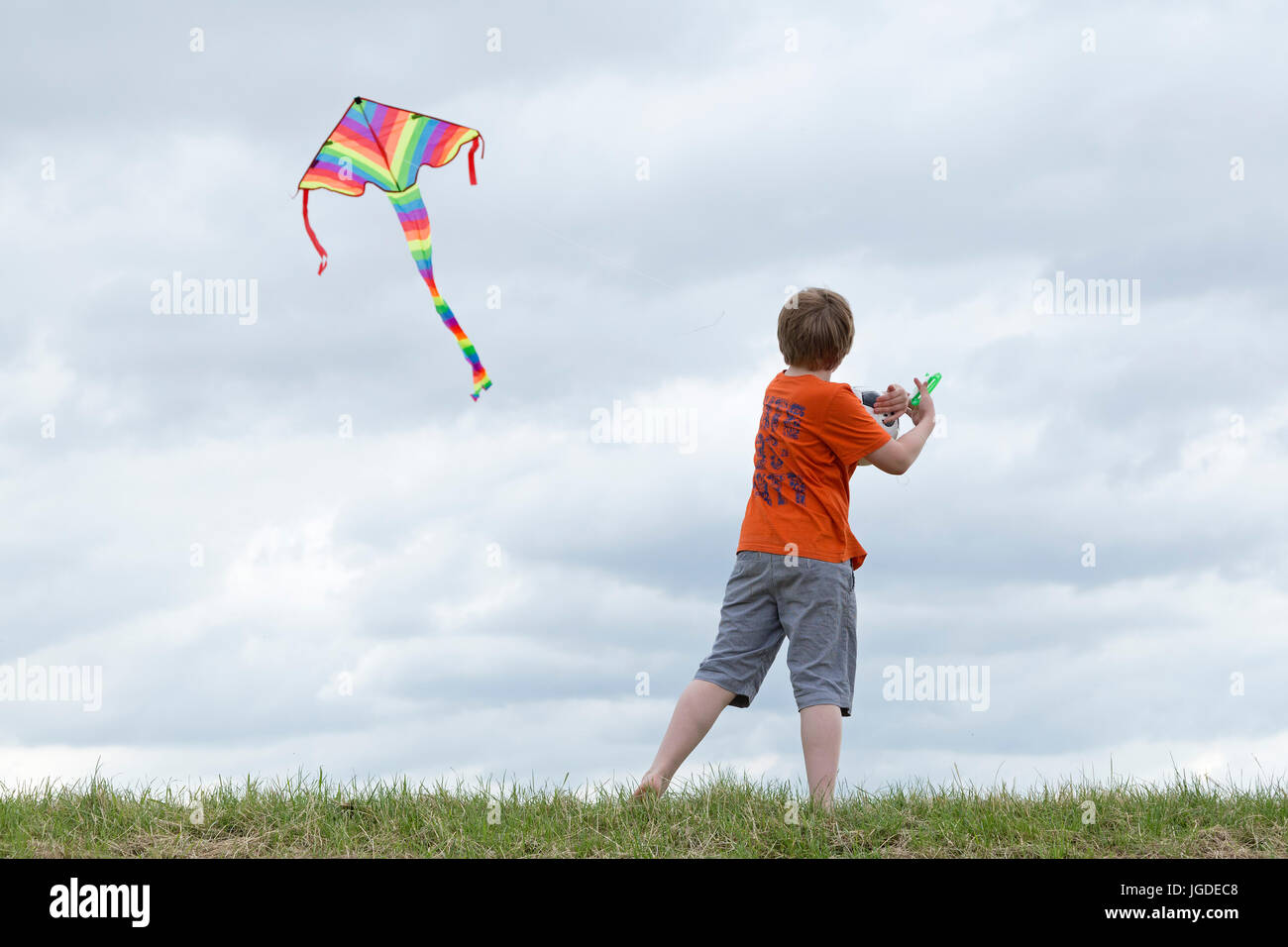 young boy flying kite Stock Photo Alamy