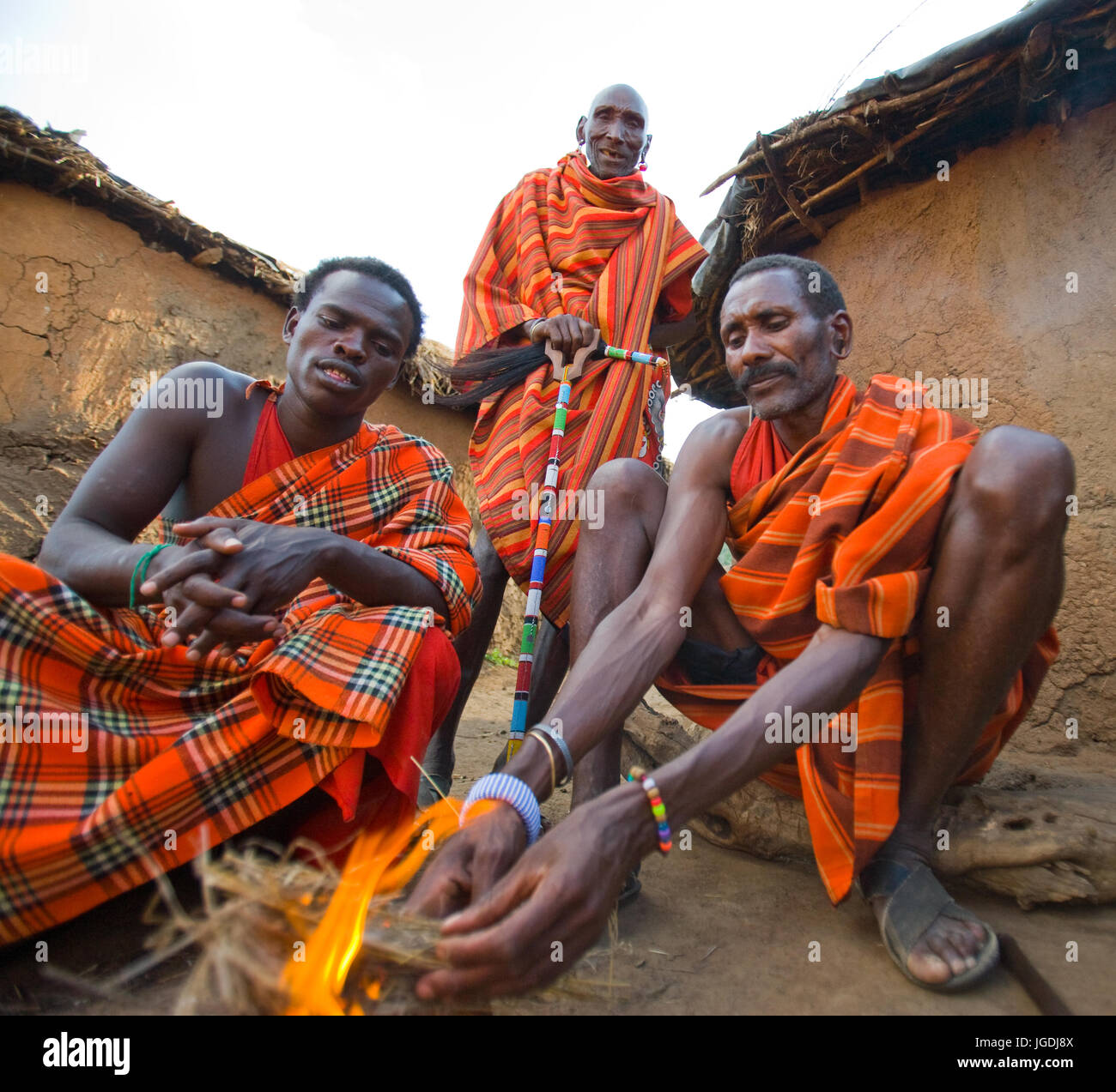 KENYA, MASAI MARA - JULY 19, 2011: Men Masai tribe make a fire in the traditional way. Stock Photo