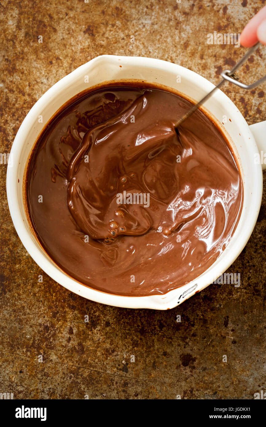 Chocolate filling for chocolate pie in pot Stock Photo Alamy