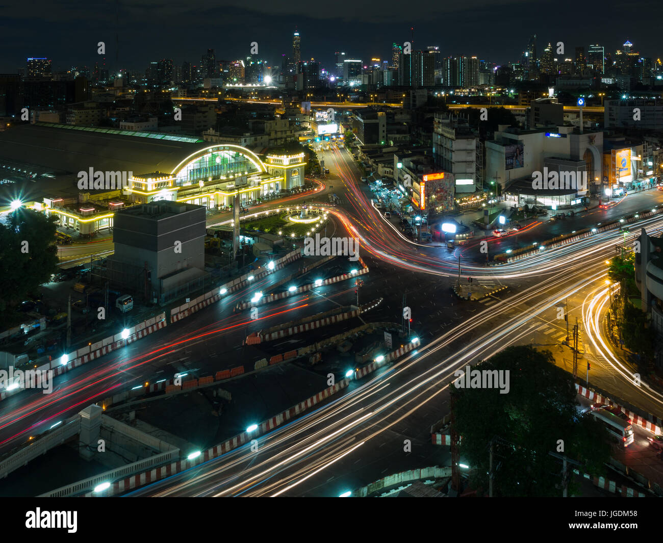 Bangkok train station known as Hualampong cityscape with vehicle light trails in the night Stock Photo