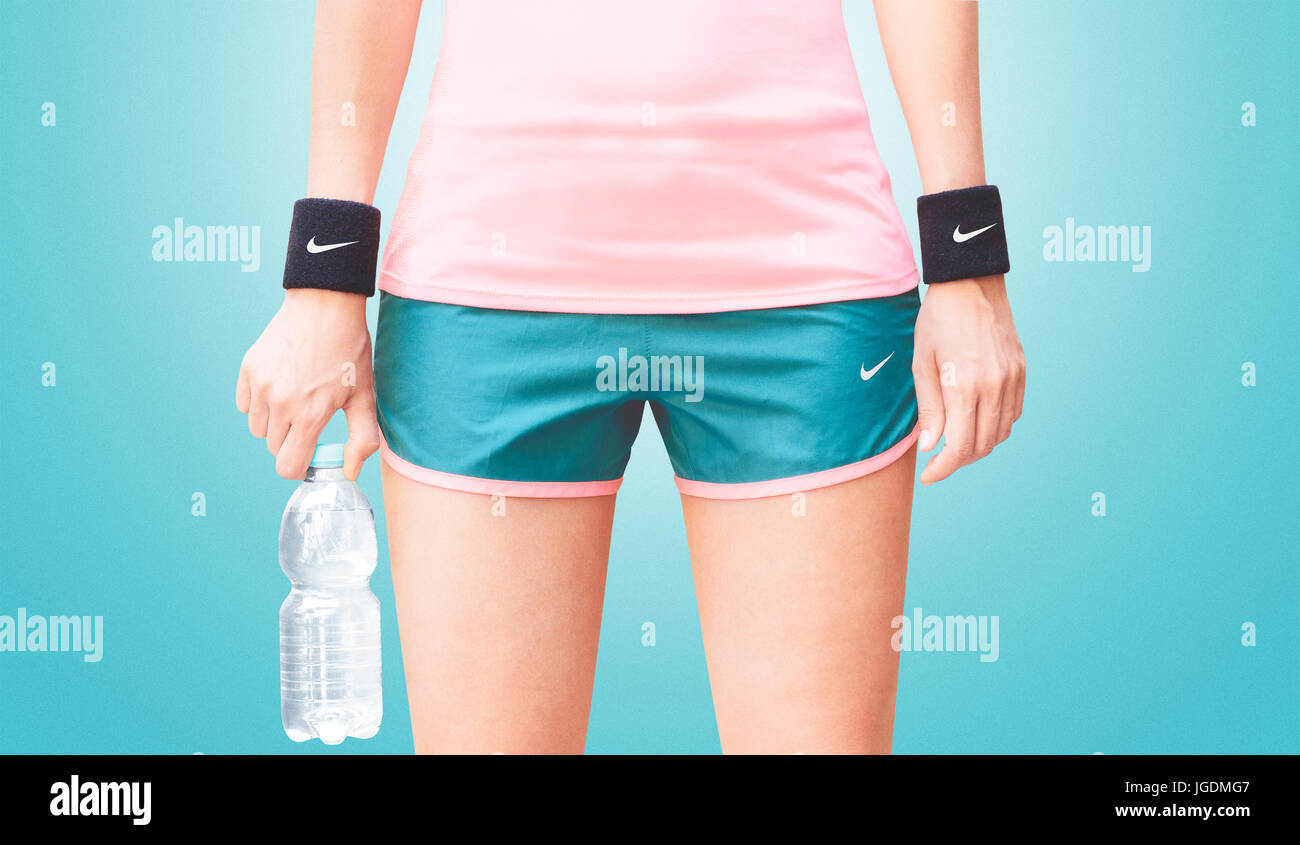 Nike sportswear, woman fitness running Stock Photo